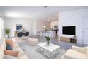 Open concept living room, kitchen, and dining area with modern finishes at 4278 Green Gables Pl, Kissimmee, FL 34746