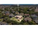 An aerial view showcasing the house's location in a residential neighborhood at 10527 Emerald Chase Dr, Orlando, FL 32836