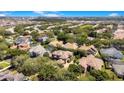 Wide shot of house and surrounding neighborhood from above at 10527 Emerald Chase Dr, Orlando, FL 32836