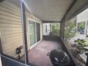 Screened-in porch with concrete flooring and space for outdoor grilling at 1123 Spring Meadow Dr # 1123, Kissimmee, FL 34741