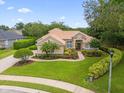 House exterior with landscaping and a fountain at 277 Olivia Rose Ct, Lake Mary, FL 32746