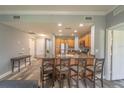 Modern kitchen with granite island and wood cabinets at 7673 Heritage Crossing Way # 101, Reunion, FL 34747