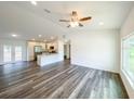 Open concept living room with kitchen and vinyl flooring at 51 Locust Crse, Ocala, FL 34472
