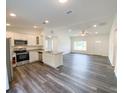 Open kitchen features modern appliances and spacious island at 51 Locust Crse, Ocala, FL 34472
