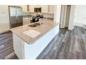 Modern kitchen with large island and stainless steel appliances at 51 Locust Crse, Ocala, FL 34472