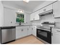 Modern kitchen with stainless steel appliances and granite countertops at 538 Windmeadows St, Altamonte Springs, FL 32701