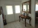 Elegant entryway with a large ornate mirror and console table at 713 W 2Nd St, Lakeland, FL 33805