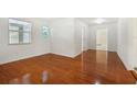 Clean hallway with hardwood floors and access to other rooms at 1338 Vassar St, Orlando, FL 32804