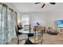 Small dining area with glass table and four chairs at 1624 Hawksbill Ln, Saint Cloud, FL 34771