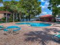 Relaxing community pool with patio furniture at 1181 Paseo Del Mar # D, Casselberry, FL 32707