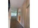 Hallway view shows access to living room, kitchen, and other rooms at 10420 Kiplinger Ln # 238, Orlando, FL 32829