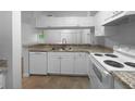 Kitchen with white cabinets, granite countertops, and modern appliances at 2323 Arbor Lakes Cir # 2323, Sanford, FL 32771