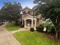 Two-story building with welcoming entryway and landscaping at 2323 Arbor Lakes Cir # 2323, Sanford, FL 32771