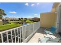 Balcony overlooking a pond, green space, and other townhomes at 17401 Serenidad Blvd, Clermont, FL 34714