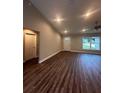 Spacious living room featuring wood-look floors and high ceilings at 12202 Se 87Th Ct, Belleview, FL 34420