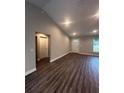 Bright living room with wood-look floors and high ceilings at 12202 Se 87Th Ct, Belleview, FL 34420