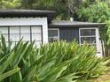 Side view of a white house with black trim at 1639 Silver Star Rd, Orlando, FL 32804