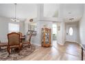 Charming dining area with a glass-top table and kitchen access at 1013 Nin St, Orlando, FL 32835