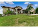 One story home with landscaping and driveway at 1905 Sanderling Dr, Clermont, FL 34711