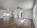 Bright and spacious living room with wood-look flooring at 7609 Rose Ave, Orlando, FL 32810