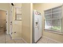 White appliances and wood cabinets in this kitchen at 4527 Alberto Cir, Kissimmee, FL 34746