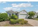 Beautiful two-story home with gray siding and blue shutters at 2132 Antilles Club Dr, Kissimmee, FL 34747