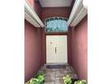 Inviting entryway with double doors and a stained glass window at 514 Tree Shore Dr, Orlando, FL 32825