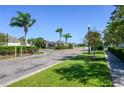Gated community with palm trees and lush landscaping at 2531 Lyndscape St, Orlando, FL 32833