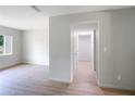 Hallway with light walls and flooring at 6809 Ambassador Dr, Orlando, FL 32818