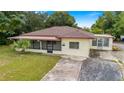 Ranch style home with carport and large yard at 1404 E Alfred St, Tavares, FL 32778