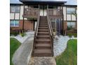Two story building exterior with stairs and landscaping at 5329 Hansel Ave # B-4, Edgewood, FL 32809