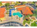 Community pool with surrounding lounge area at 1107 Park Ridge Cir, Kissimmee, FL 34746