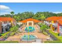 Aerial view showing resort-style pool and playground at 1107 Park Ridge Cir, Kissimmee, FL 34746