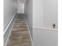 Indoor staircase with wood-look tile and neutral wall colors at 4368 S Kirkman Rd # 212, Orlando, FL 32811