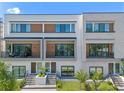 Modern townhome building with stone and wood accents at 42 W Harding St # B, Orlando, FL 32806
