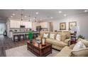 Open-concept living area with hardwood floors and large windows at Unknown Arthur Ave, Edgewater, FL 32141