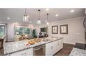 Modern kitchen with granite countertops and stainless steel appliances at Unknown Arthur Ave, Edgewater, FL 32141