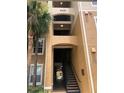 Building entrance with a staircase and walkway at 6451 Old Park Ln # 110, Orlando, FL 32835