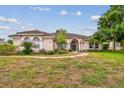 Lovely one-story home, tile roof, and nicely landscaped yard at 445 Hightower Dr, Debary, FL 32713