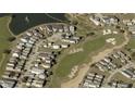 Aerial view showcasing home's location in a golf course community at 1535 Corolla Ct, Reunion, FL 34747