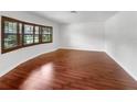Spacious living room with hardwood floors and large windows at 509 Savona Ct, Altamonte Springs, FL 32701