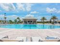 Resort-style pool with a swim-up bar and lounge chairs at 1411 Clubman Dr, Davenport, FL 33896