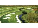 Aerial view of championship golf course with lush greens at 1411 Clubman Dr, Davenport, FL 33896