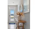 Bright entryway with a wooden console table and pampas grass at 1983 Tamarack Pass, Davenport, FL 33837