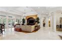 Spacious living room with high ceilings, a large TV, and comfortable seating at 11261 Macaw Ct, Windermere, FL 34786