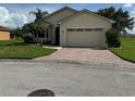 One-story home with a two-car garage and landscaped yard at 2470 Salzburg Loop, Winter Haven, FL 33884