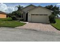 One-story home with a two-car garage and landscaped yard at 2470 Salzburg Loop, Winter Haven, FL 33884