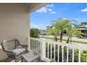 Small patio with wicker chairs and a table at 1455 Alston Bay Blvd, Apopka, FL 32703