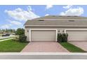 Two-car garage with brick paver driveway at 1455 Alston Bay Blvd, Apopka, FL 32703