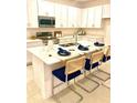 Modern kitchen with stainless steel appliances and island at 1436 Silver Lining Way, Apopka, FL 32703